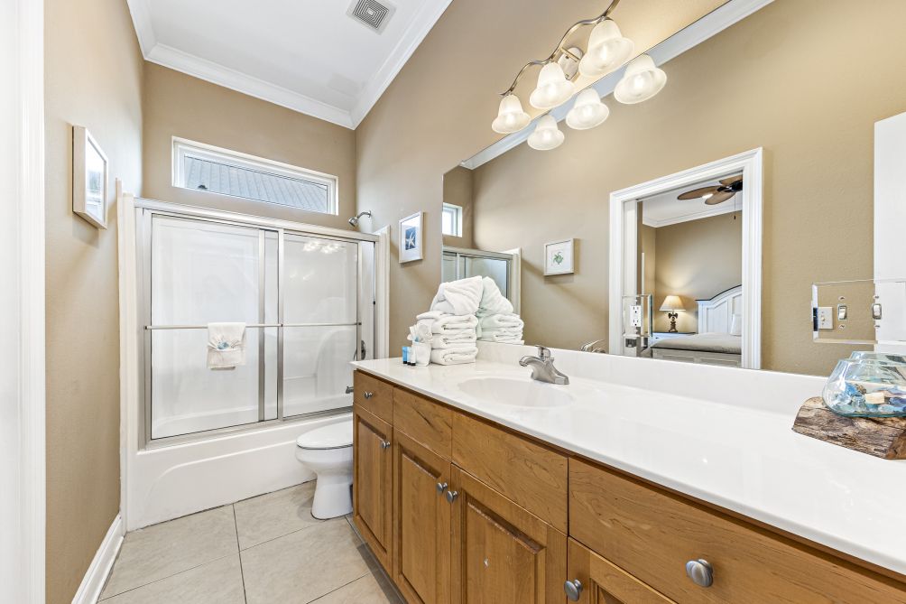 Bathroom with tub/shower and wood vanity