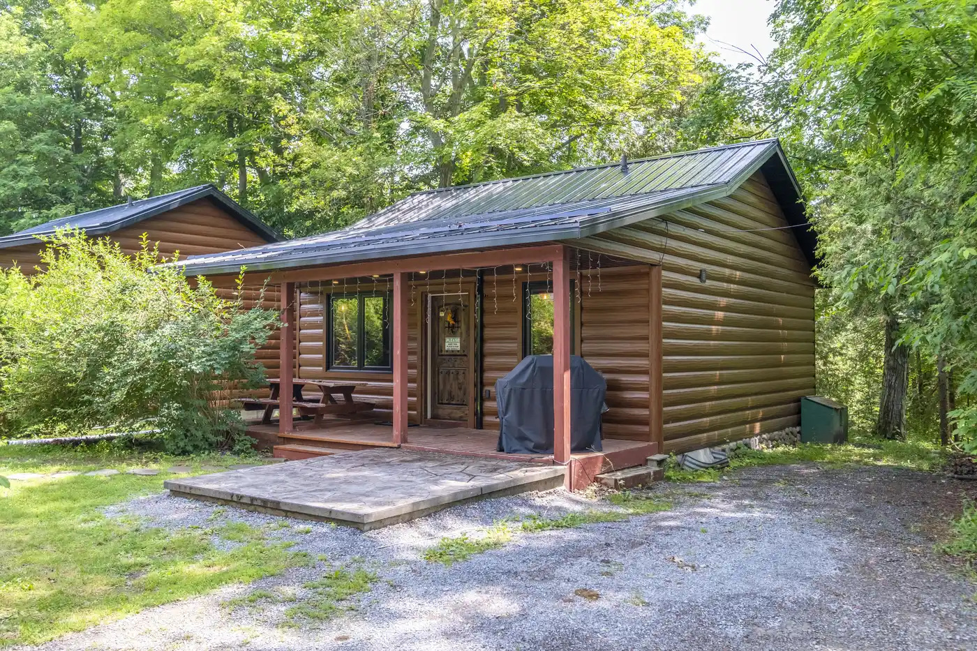 Front exterior of Cottage #6 surrounded by mature trees