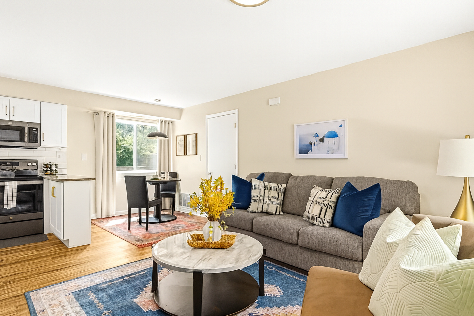 Relax in our inviting living room furnished with cozy seating and a smart TV for your entertainment.