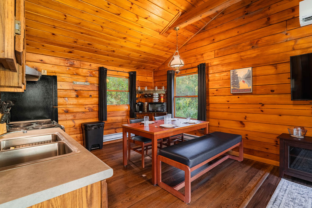 Open-concept kitchen and dining area with full appliances and seating for up to six—perfect for meals or game night.