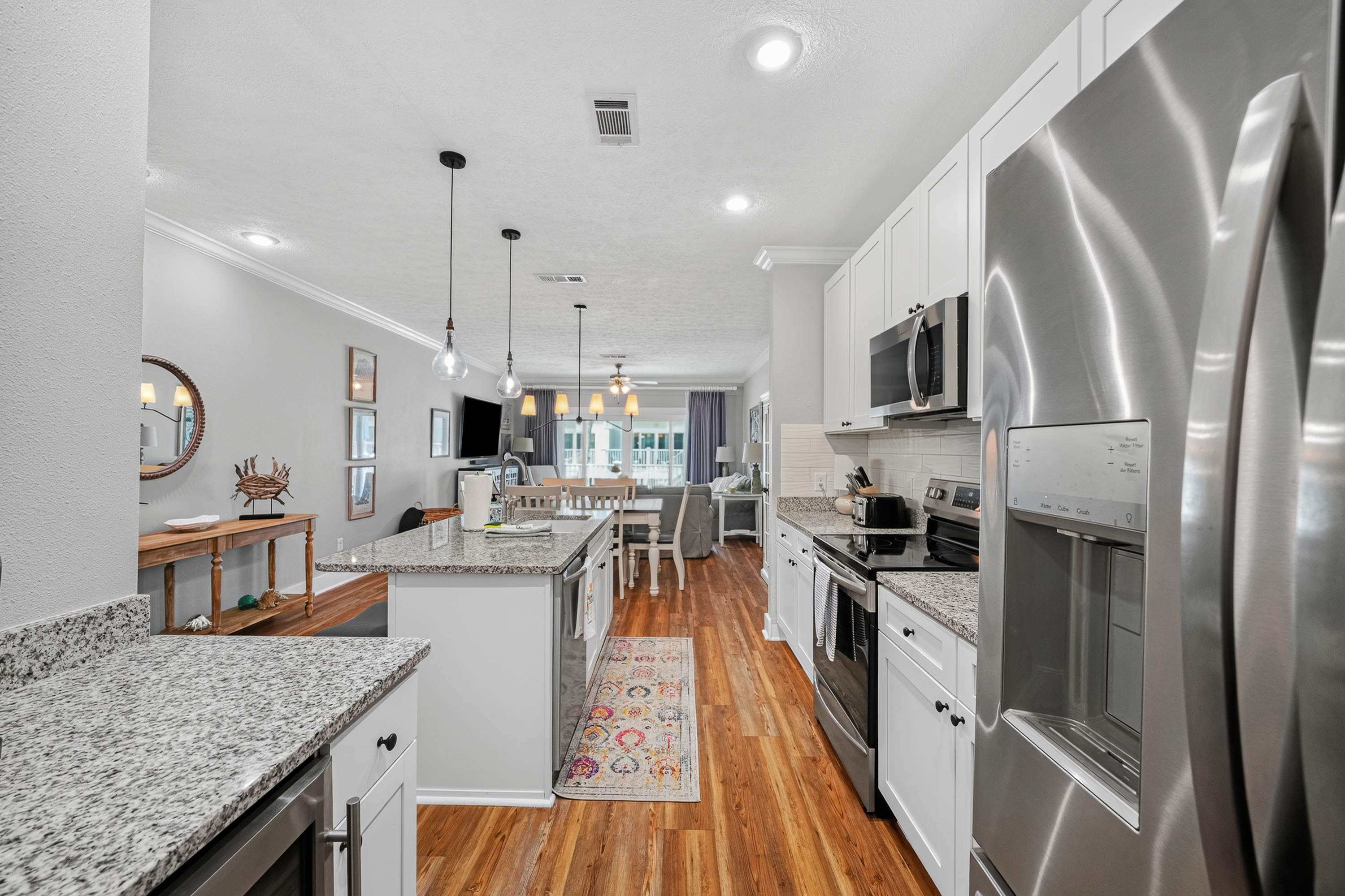 Enjoy a well-equipped kitchen that flows seamlessly into the dining and living areas