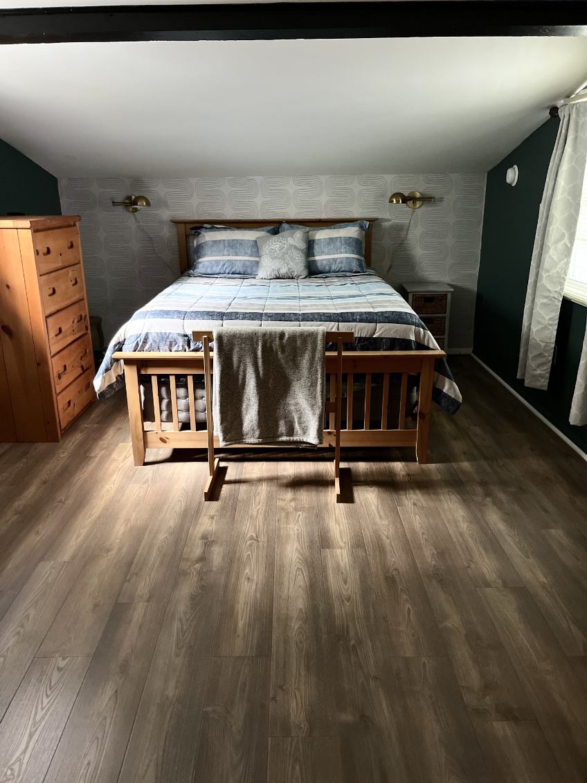 Loft bedroom with a queen bed.