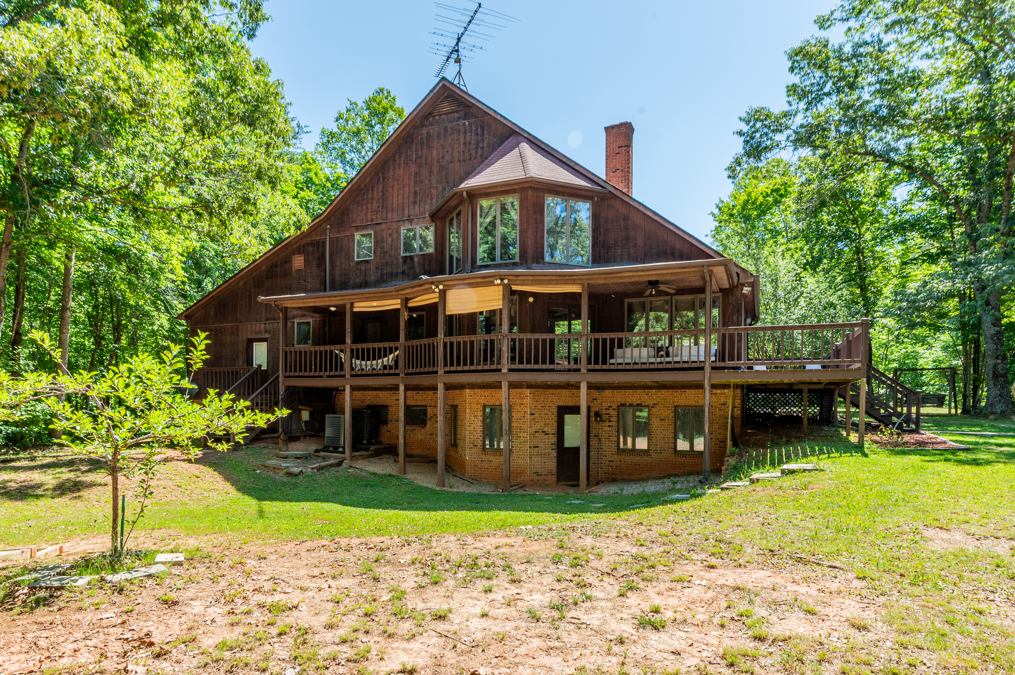 Outdoor Oasis: Embrace nature from the spacious deck, surrounded by towering trees and tranquility.