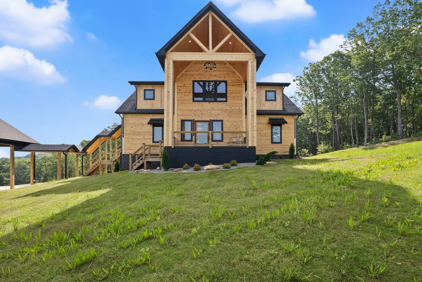 The stunning symmetrical design and double-height porch give this cabin a regal yet welcoming presence—your peaceful mountain escape awaits.