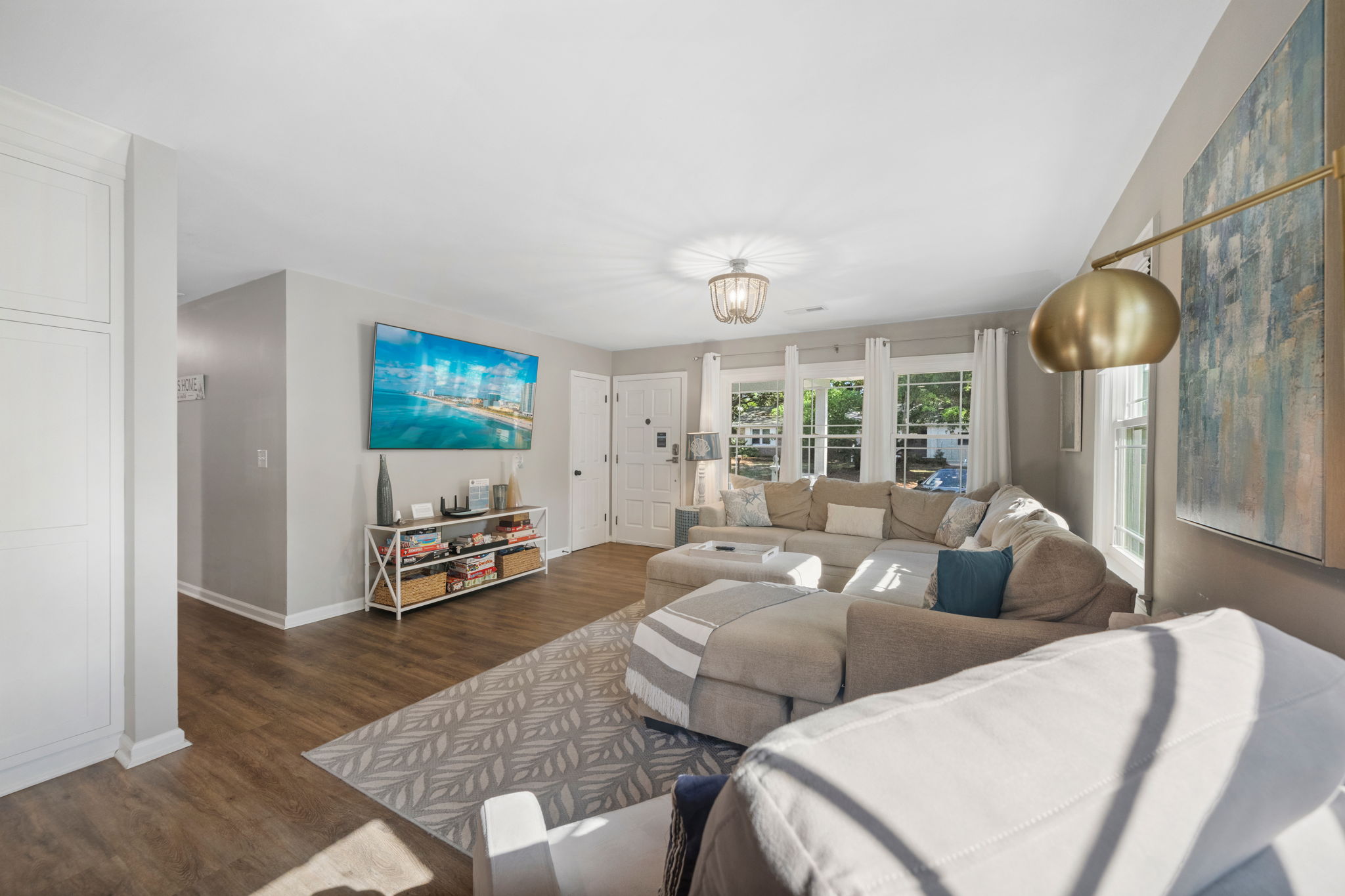 Living Room With Comfortable Sectional Sofa, Recliner, 75" Smart TV, Reading Light | IOP Escapes Beach Blessing | 3705 Hartnett Blvd, Isle of Palms, SC