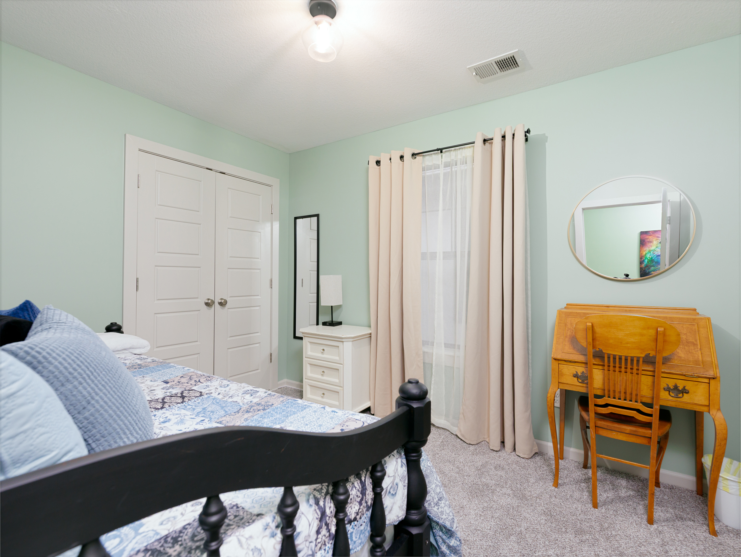 Third bedroom featuring a twin daybed with pull-out trundle, offering flexible sleeping arrangements in a comfortable, space-efficient layout.
