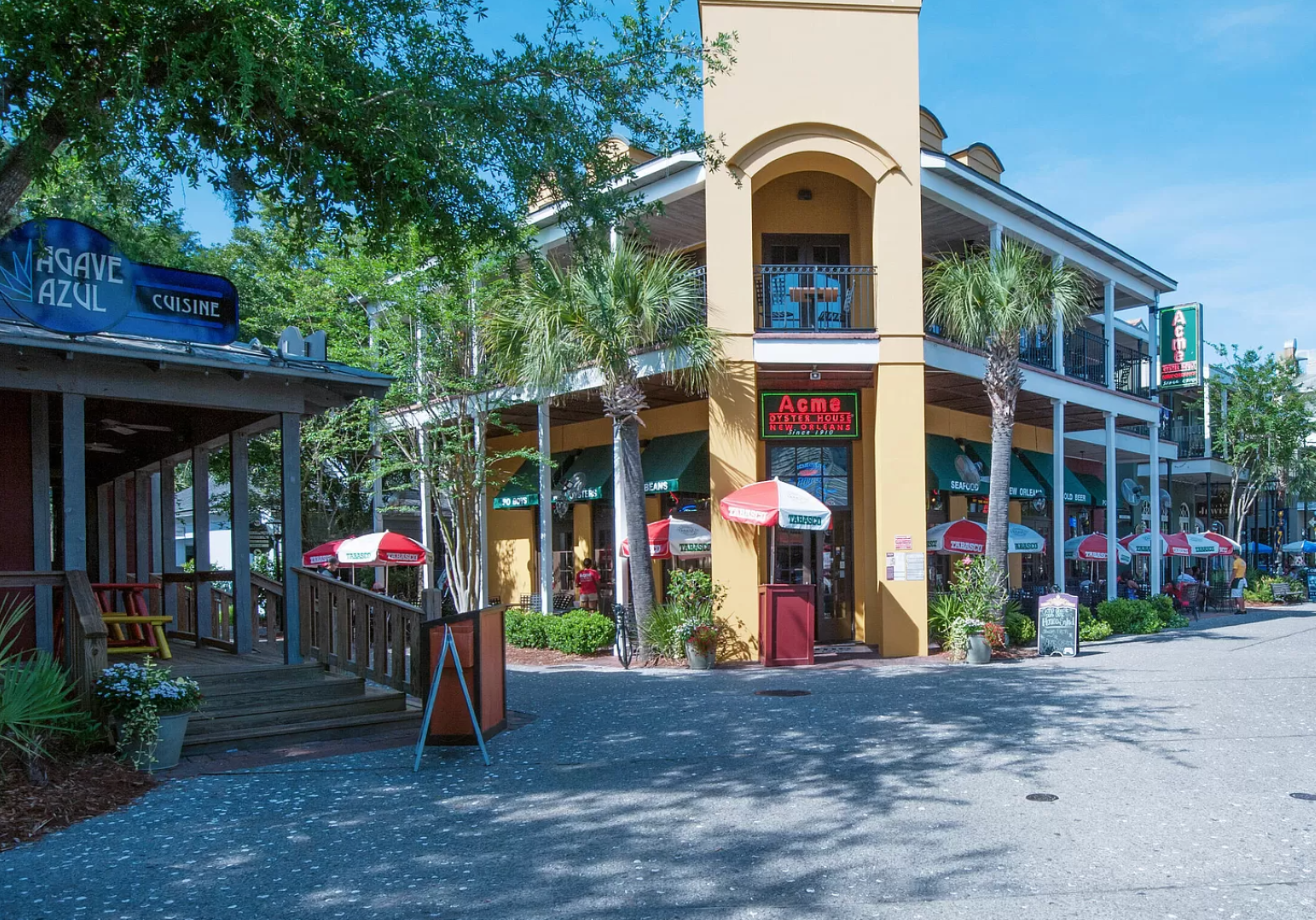 Terraces under awnings and a charming tourist town atmosphere.