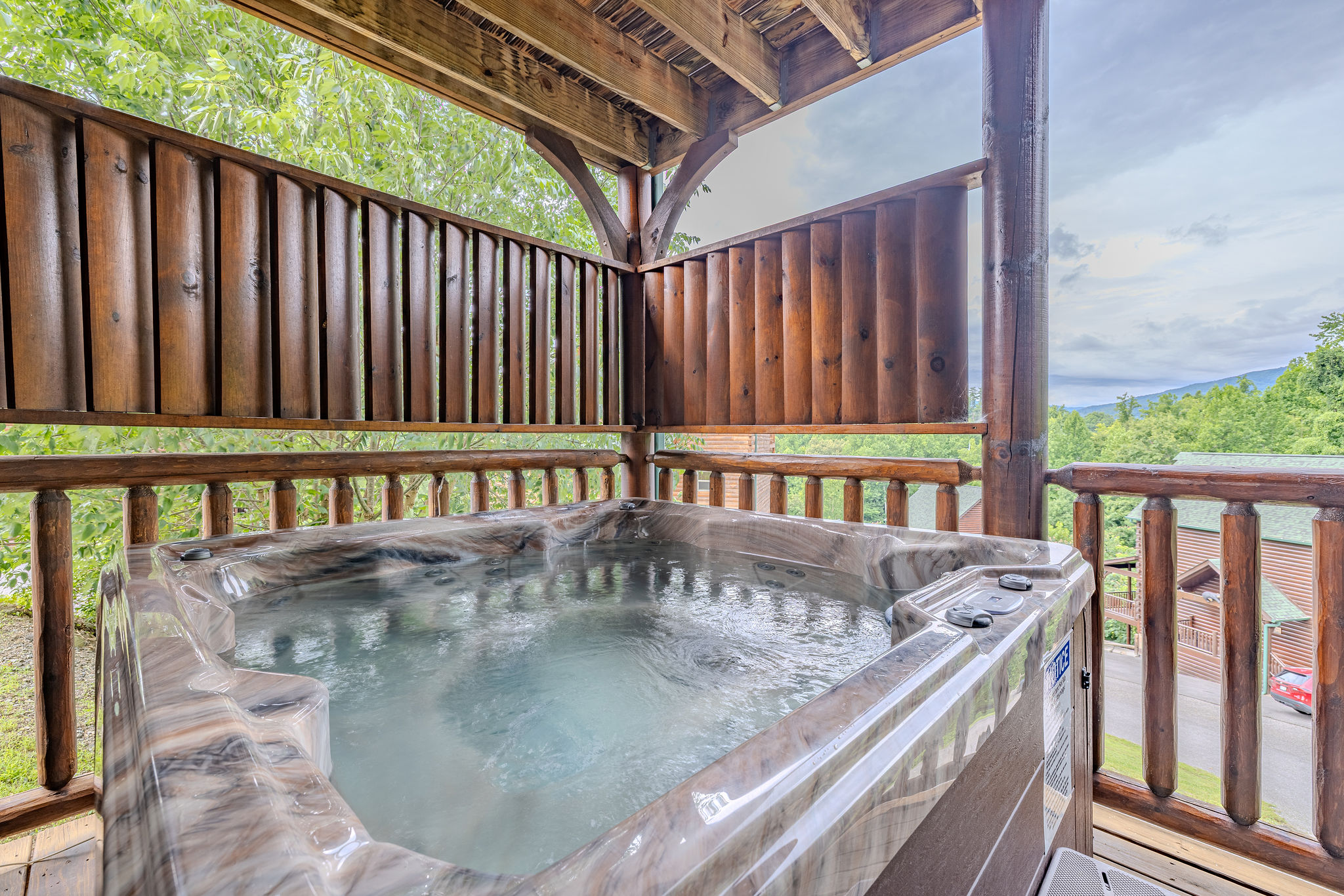 The Afterparty Soak is the private hot tub experience — perfect for unwinding after downtown Gatlinburg, movie night, or playing a game of pool in the loft.