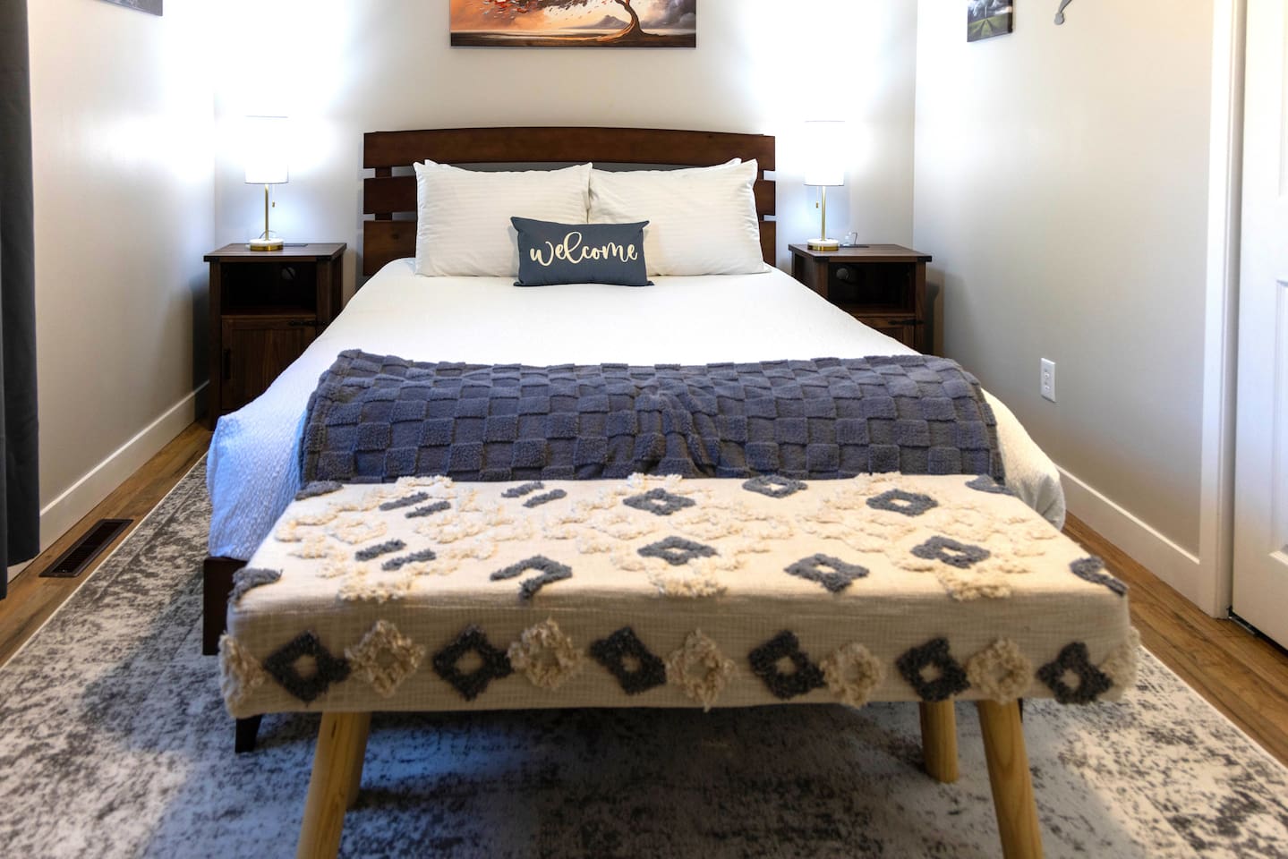 Bedroom 2- Queen Bed. Nightstands have plug- ins for charging.