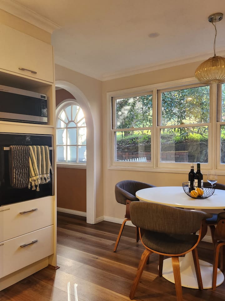 The kitchen nook is a favourite with the kids, or somewhere to chat with that important human preparing your meal. It's also a great spot to sit and work, if that's what you need to do!