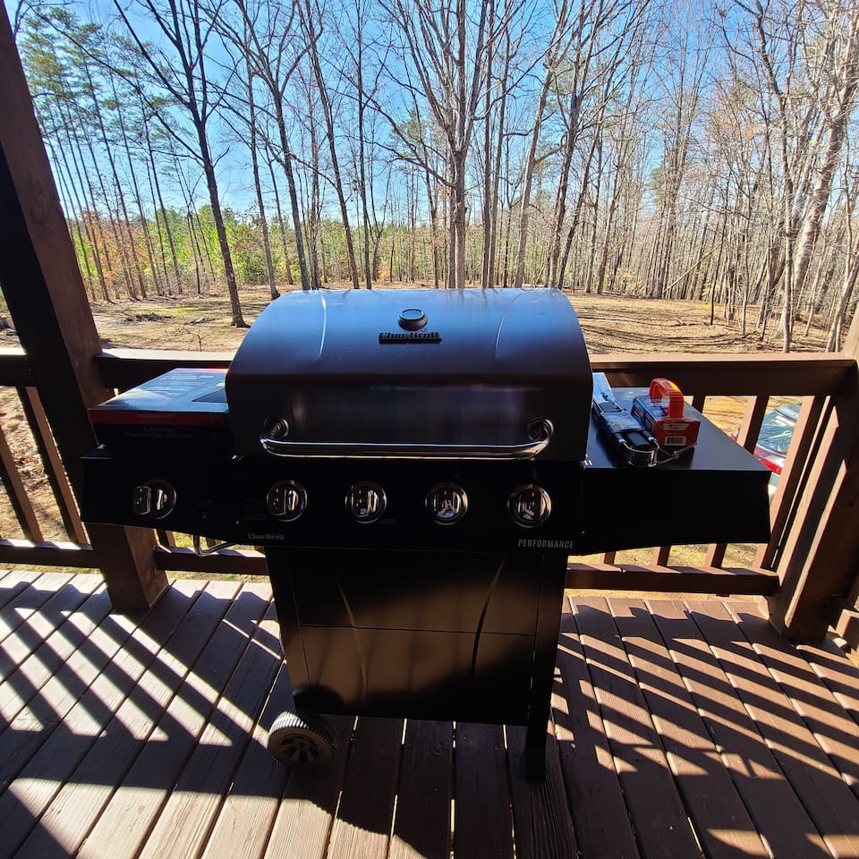 Grill Station: Sizzle under the sun with this premium barbecue setup and lovely wooded views!