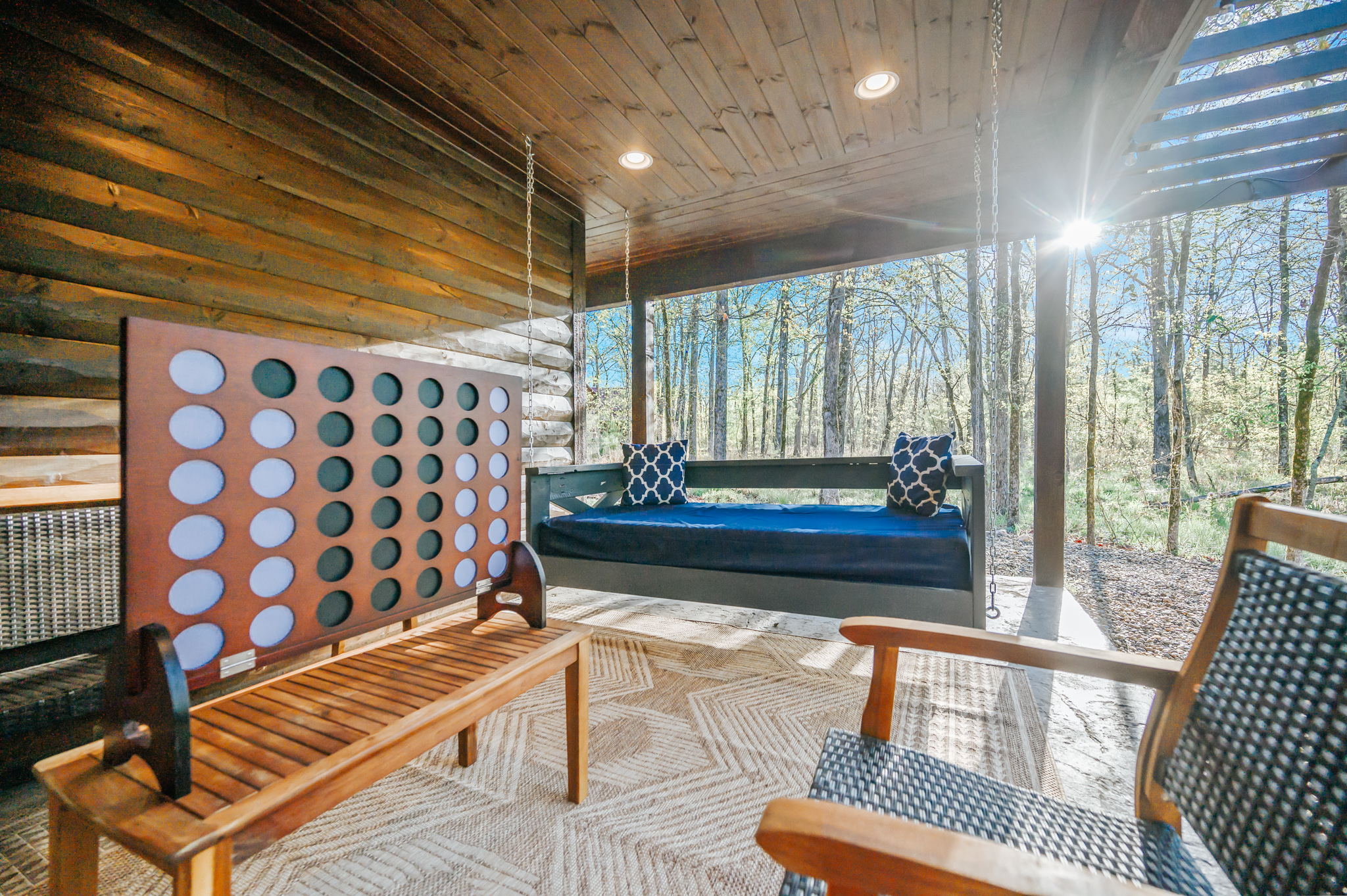 Relax with family on this back patio with TicTacToe game & bed swing for 2.