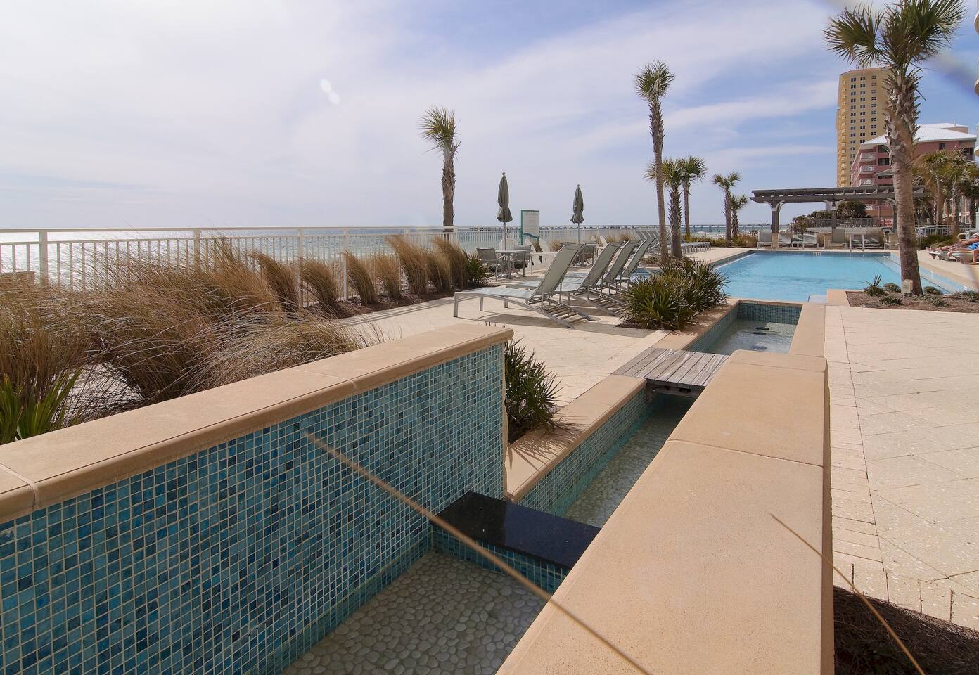 The AQUA RESORT features two elevated pools with views of the beach and the Gulf of Mexico - Plenty of seating and lounge space!