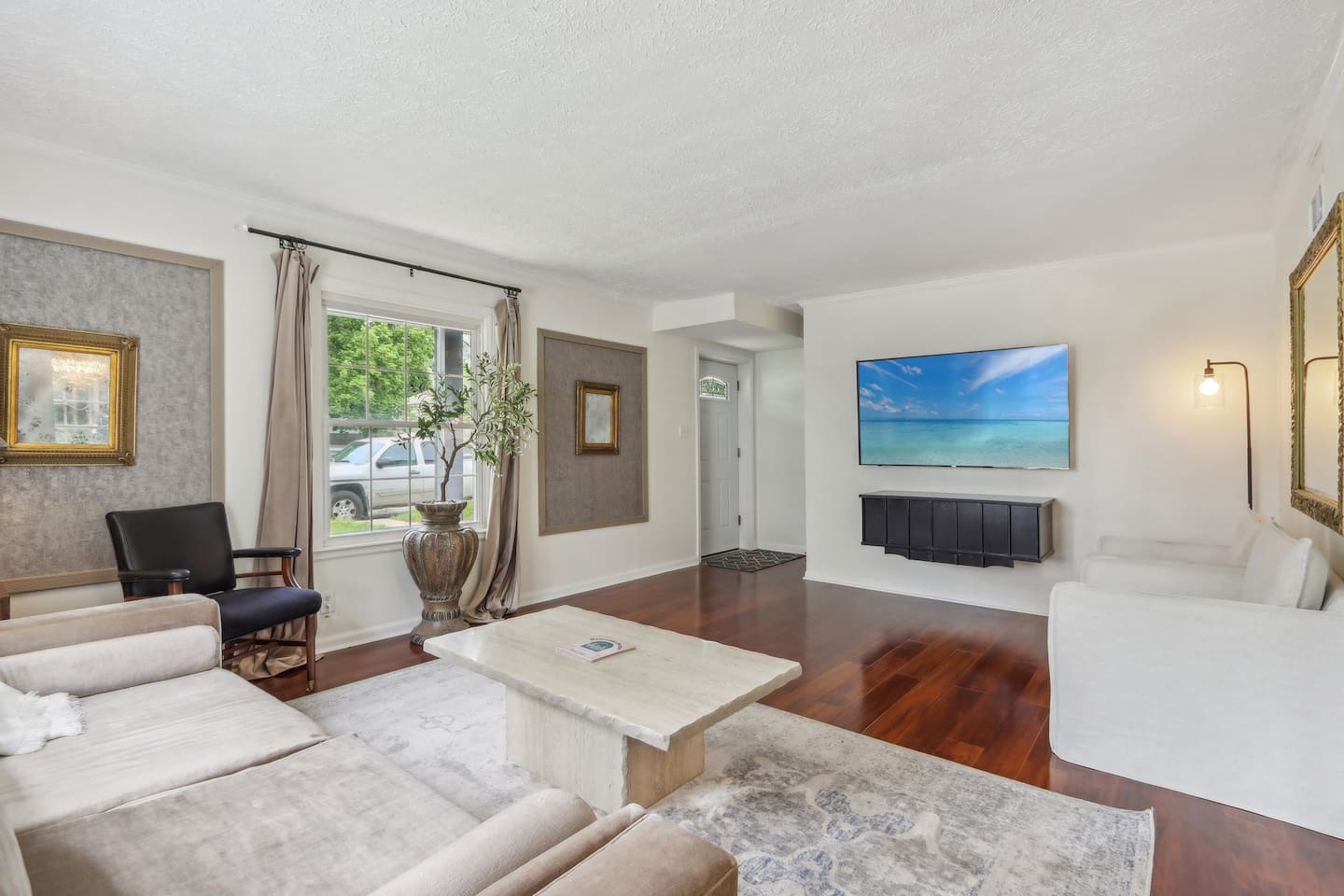 Classic meets modern in the great room, where velvet, marble, and beautiful hardwoods create a warm, inviting space. Stream your favorites and make yourself at home.