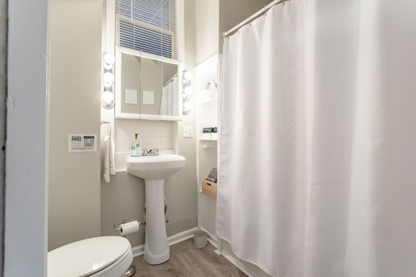 Full bathroom with a shower, spacious sink, toilet, and all essential toiletries, designed for both comfort and convenience.