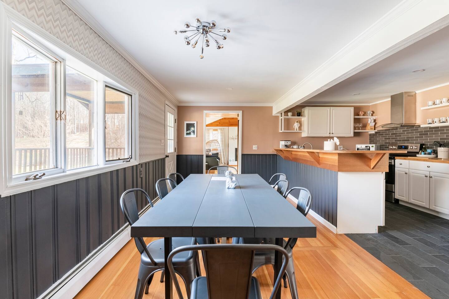 Kitchen with view to the living room. Window to the back yard on the left.