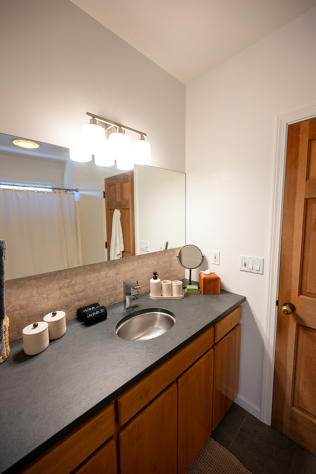 Clean and well maintained bathroom with fresh towels and essential amenities