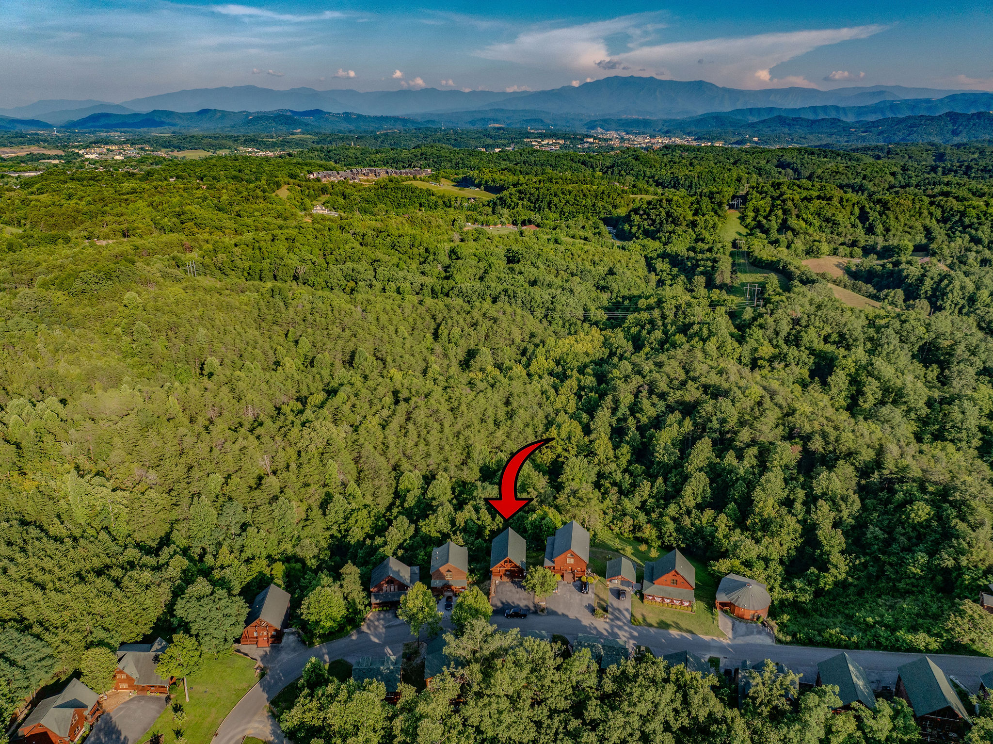 A little slice of heaven, perfectly placed within a majestic mountain backdrop.