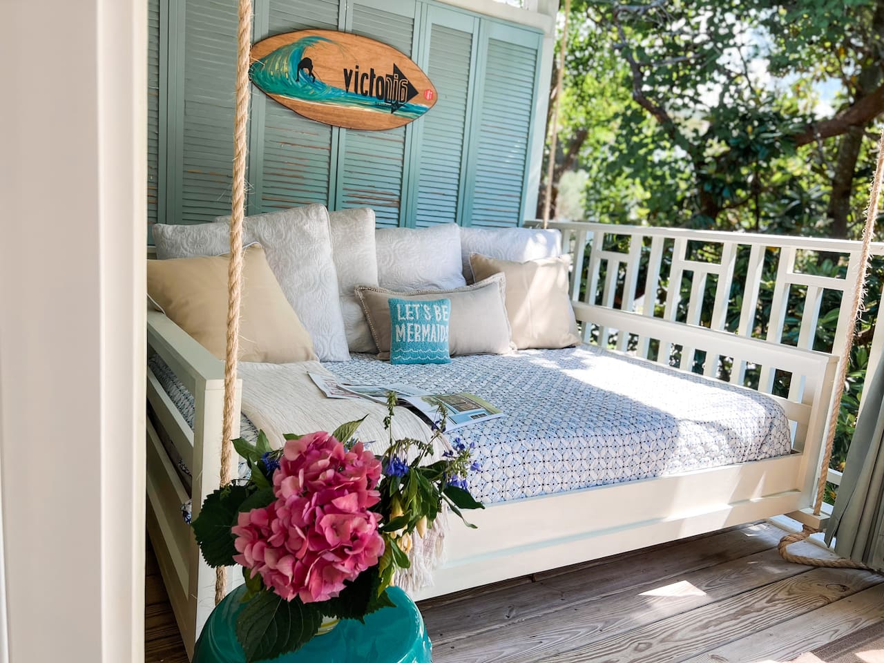 Cozy full sized swinging bed on the front deck perfect for a nap or a book!