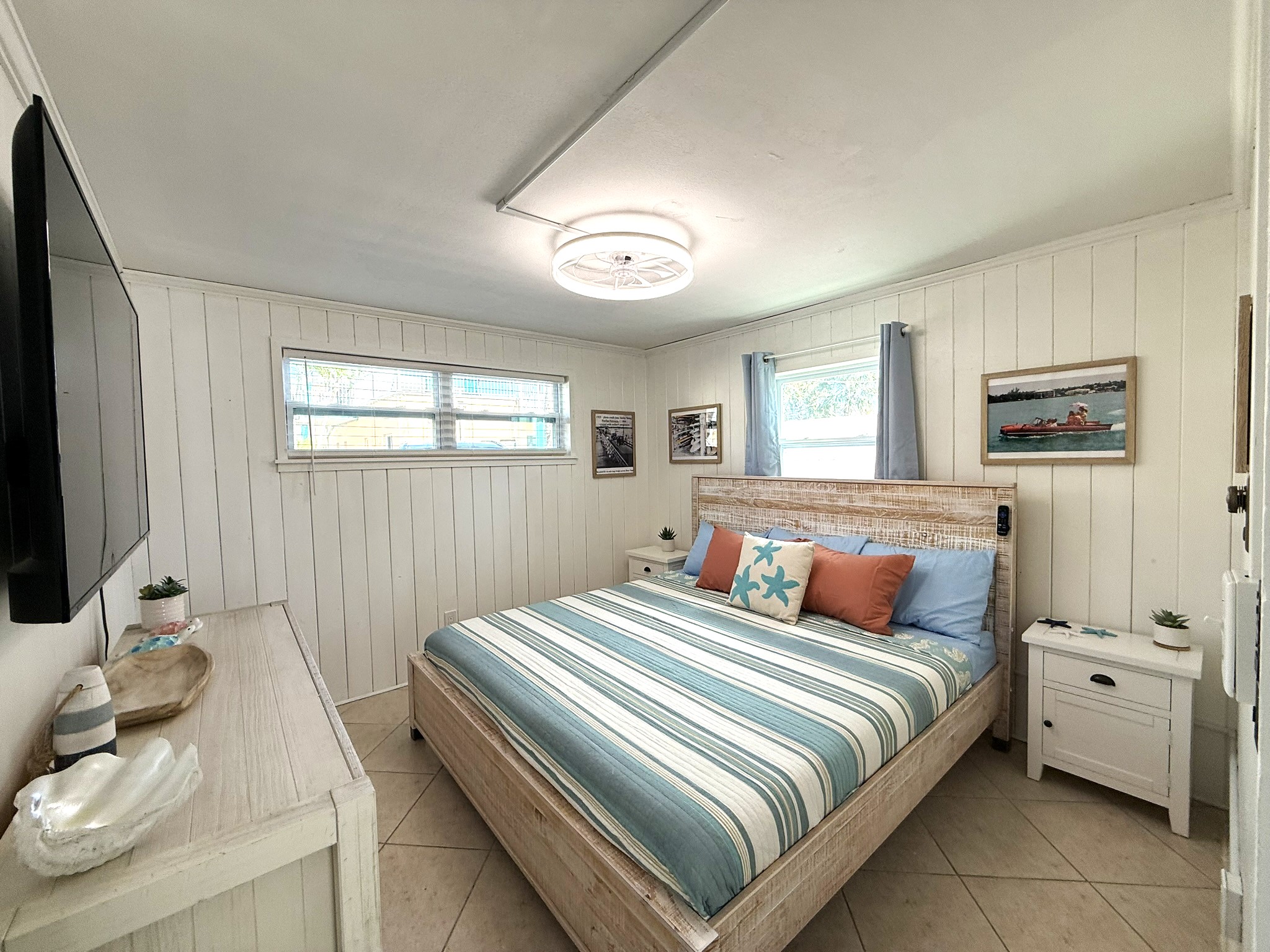 Primary Bedroom with King Bed & Retro Photos & 65" TV