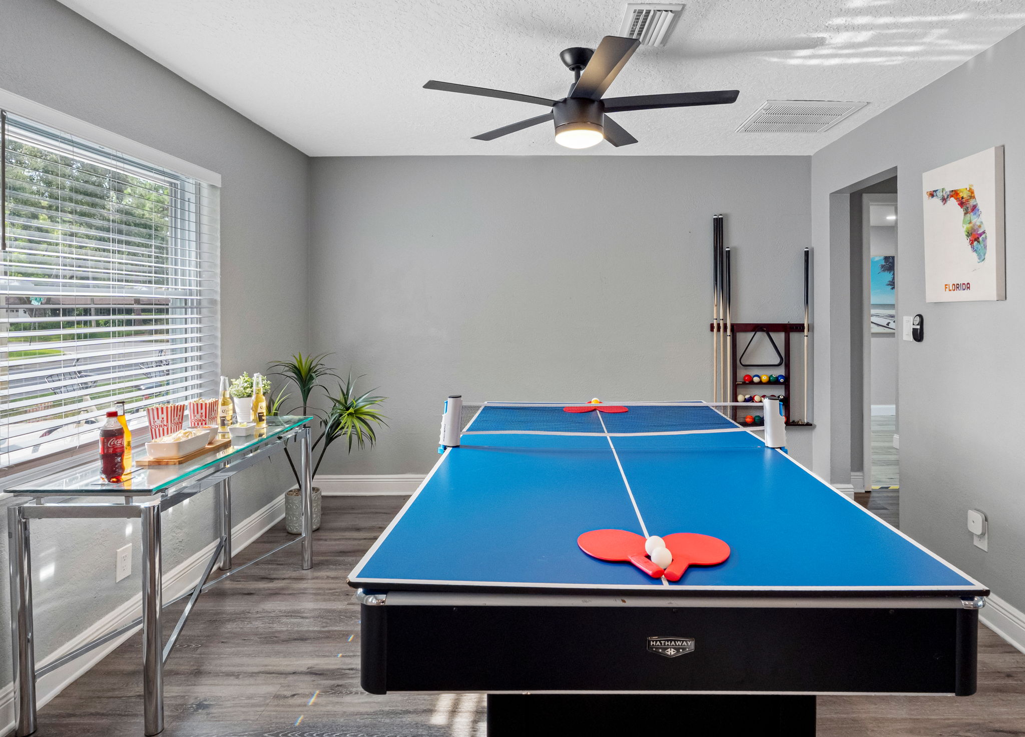 This lively game room invites friendly competition with a full-size pool table, ping pong setup, and plenty of space to gather and cheer each other on.