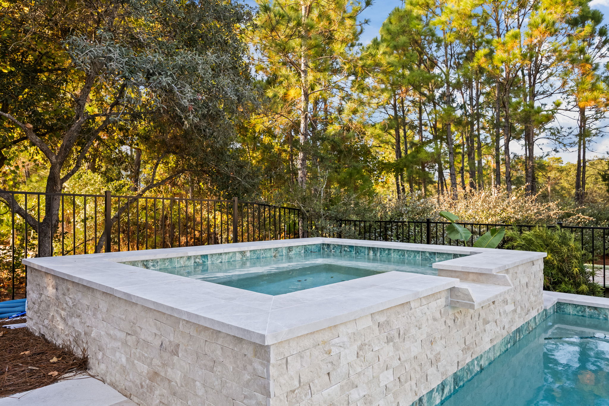 Private hot tub spa with poolside views, included with your fully private pool and outdoor living space—ideal for relaxing evenings and year-round enjoyment.