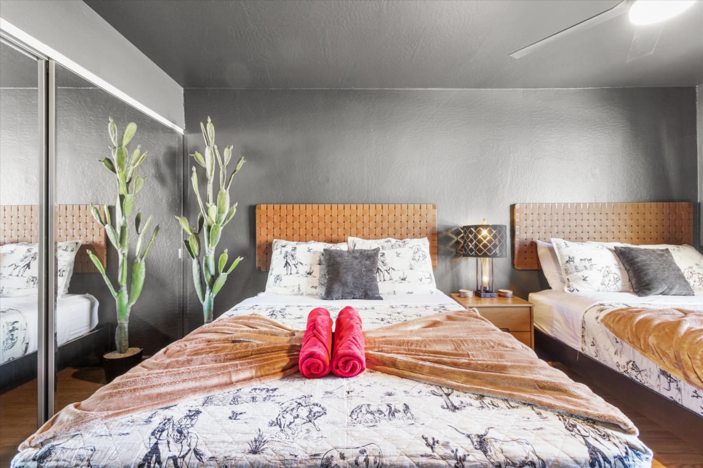 Bedroom with two queen beds, fresh towels, and a simple setup for sharing the room comfortably.
