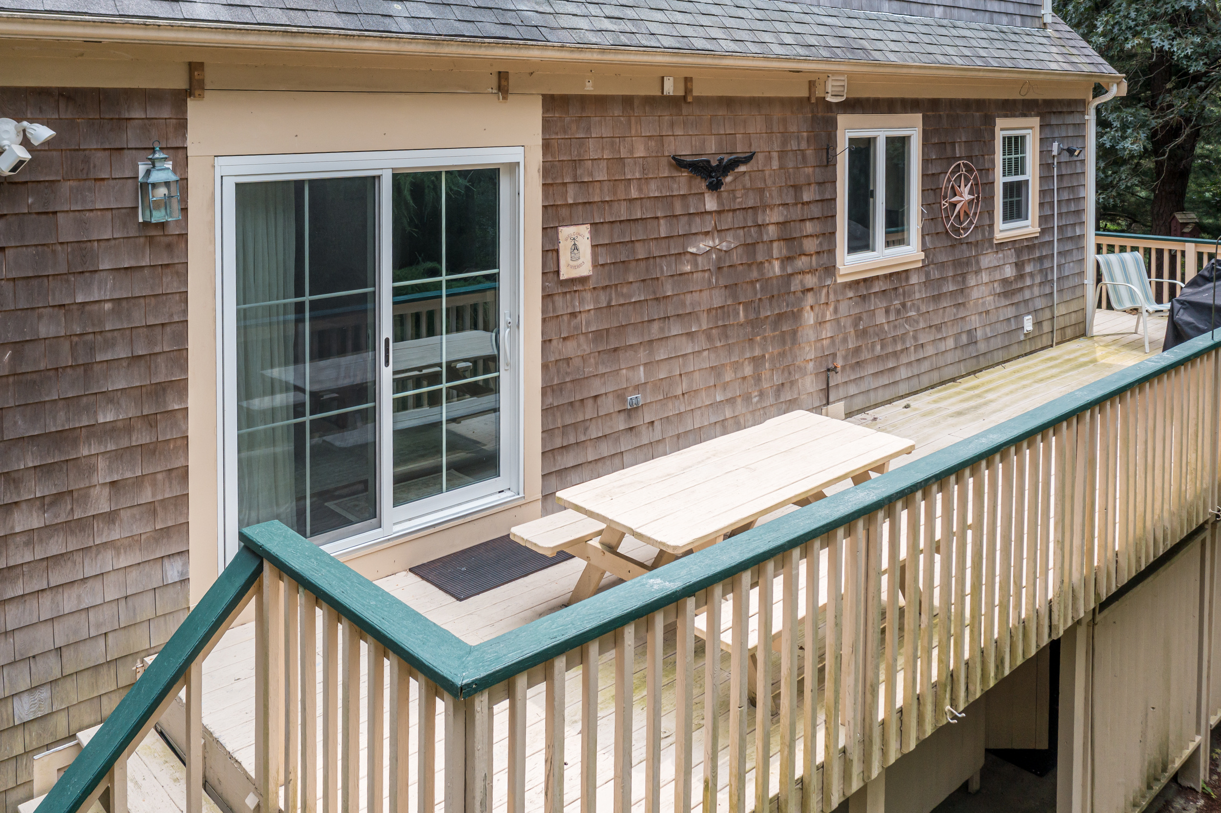 Spacious outdoor deck complete with grill and dining area.