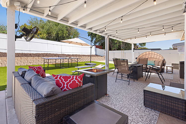 Covered patio space for relaxing by the 2 fire pits