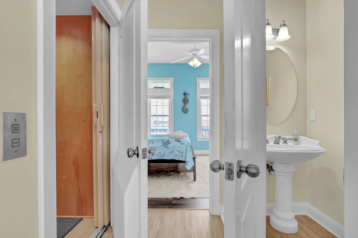 The half bath is located just off of the kitchen area on the top floor