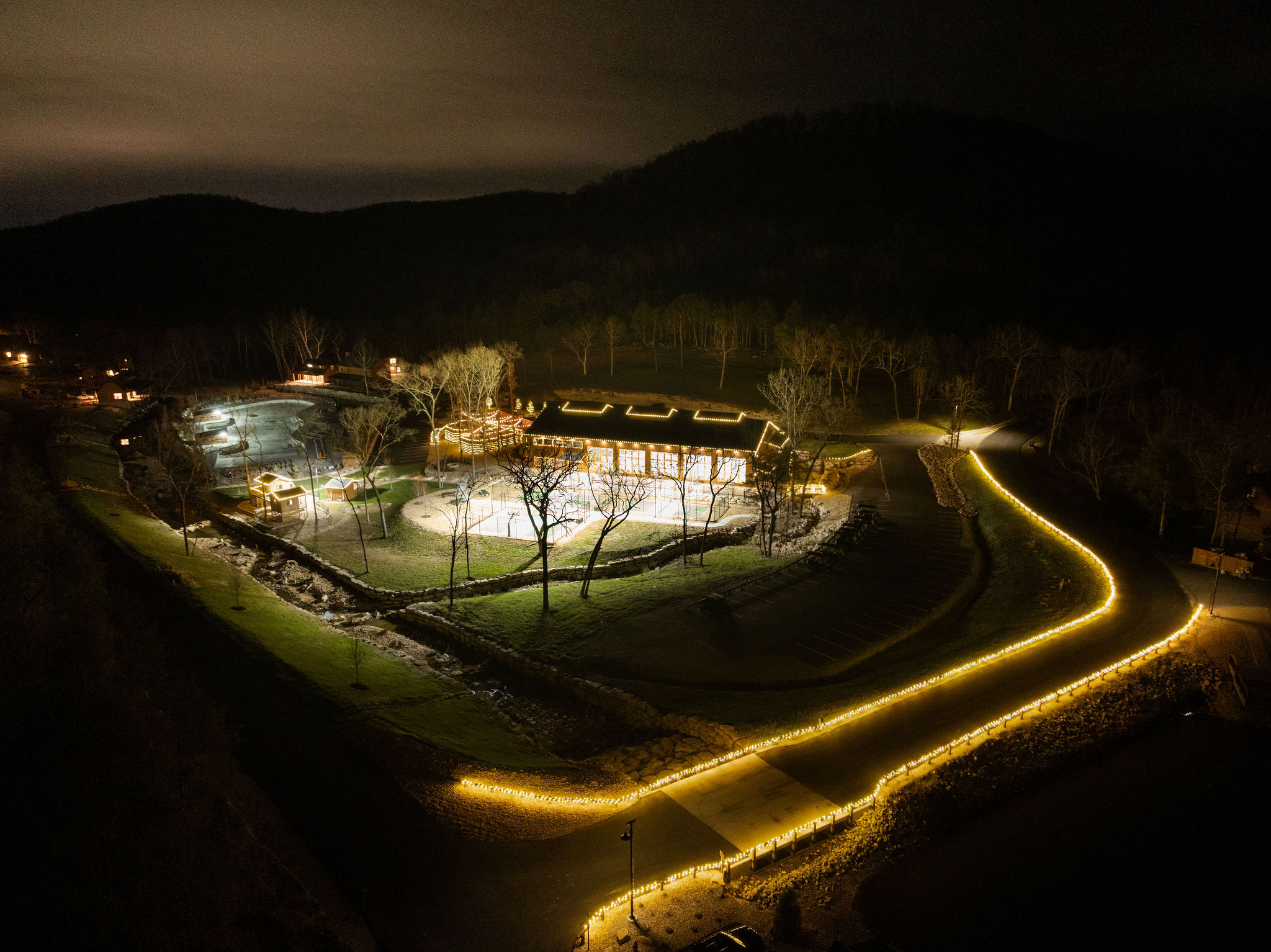Peaceful nighttime aerial view of the property and surrounding area.