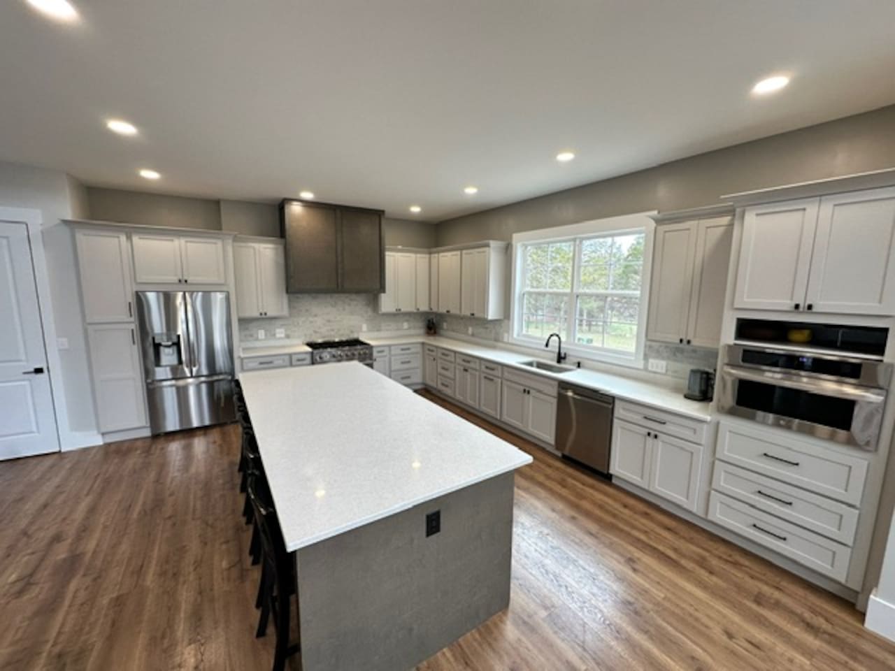 Island seats 5 with an additional two stools in the dining area. Kitchen table upgrade coming soon to accommodate even more guests. Plenty of pantry space, kitchen appliances, dishes, mugs, etc. 