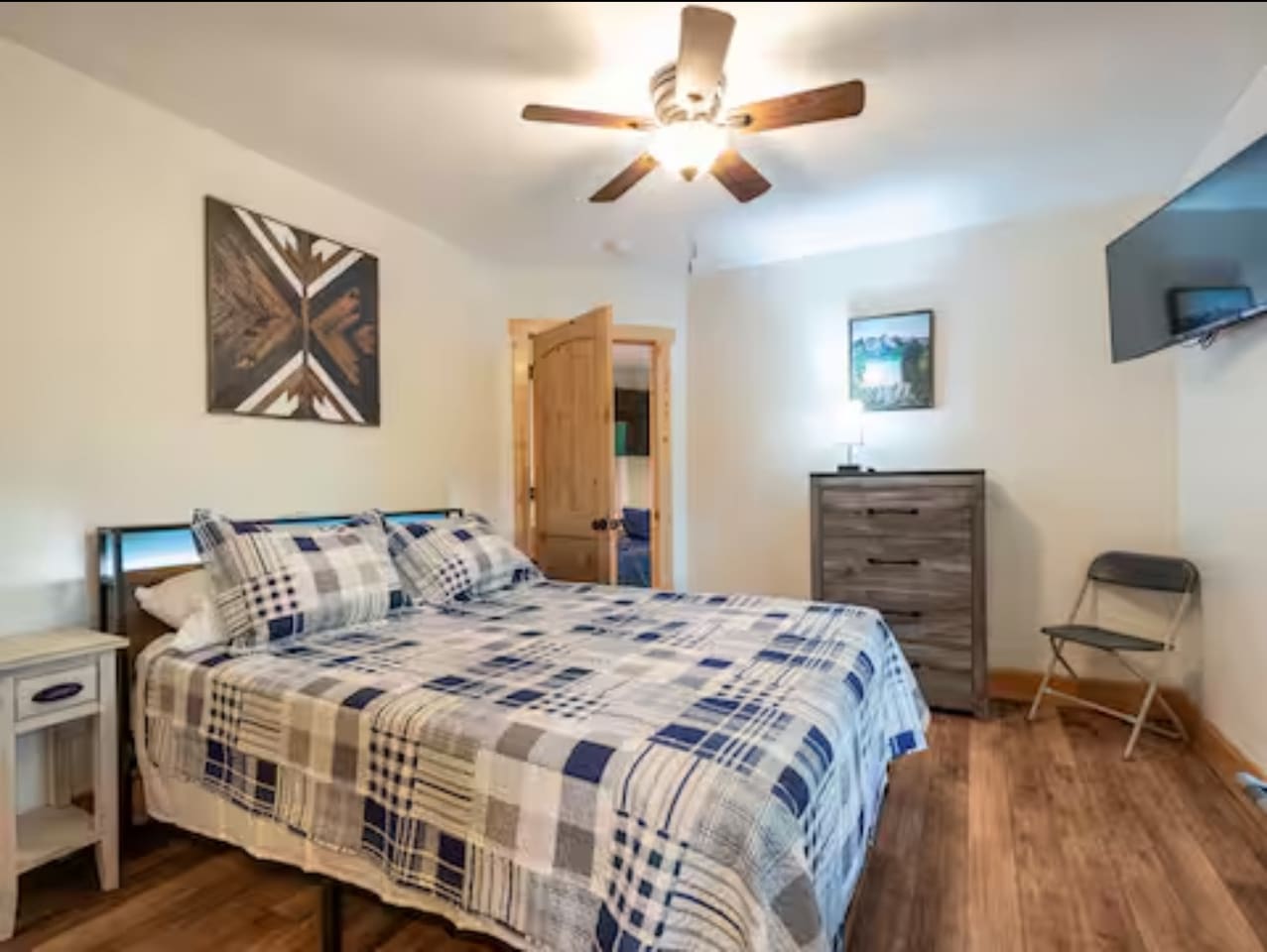 Bedroom #2 located on lower level of home / queen sized bed 