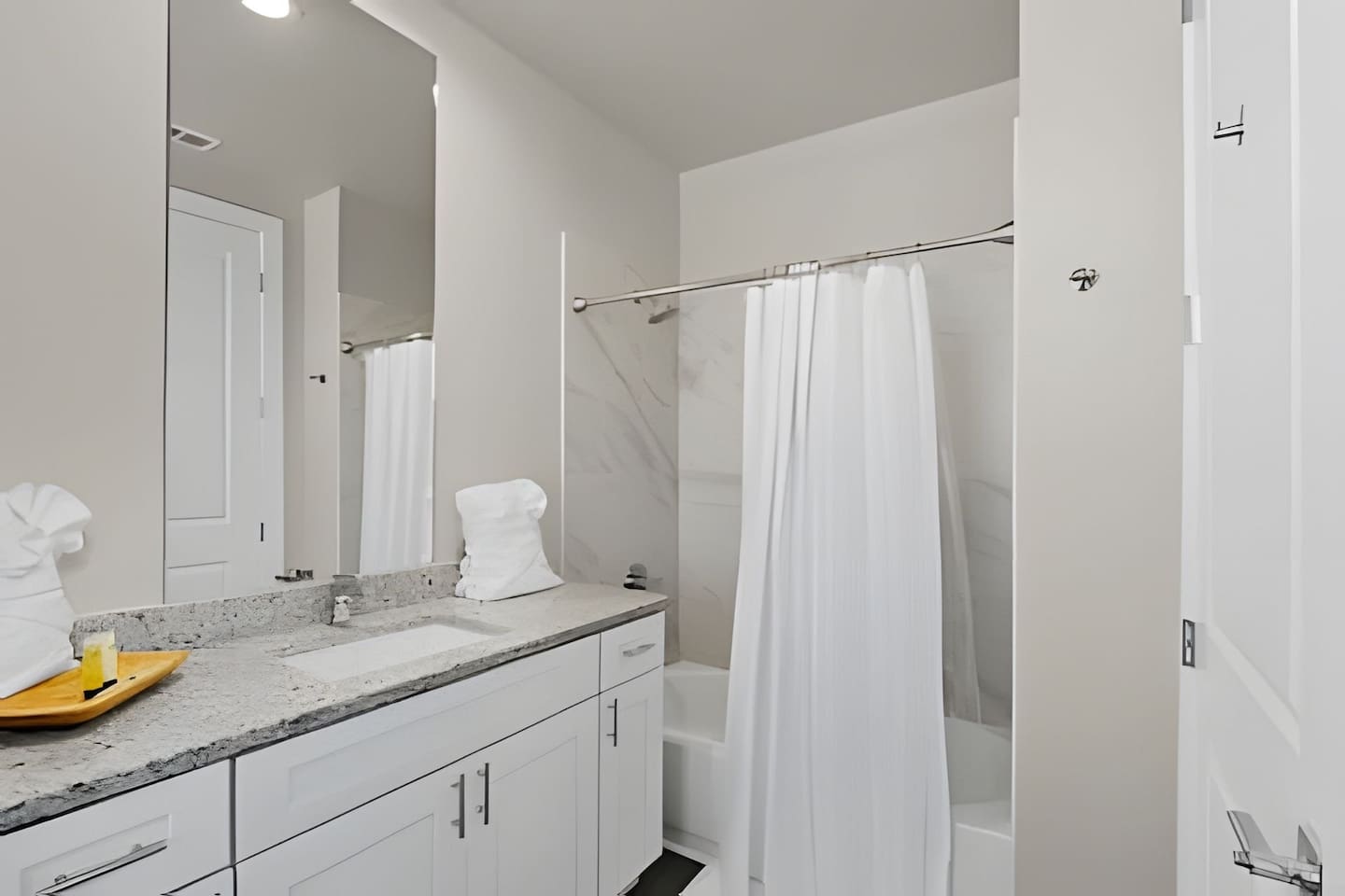 Relax in the shower after a day of adventure, in a bright and spacious bathroom.