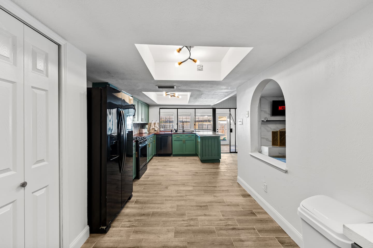 Cook and connect in this fully equipped kitchen with granite countertops, large island, and stainless steel appliances.