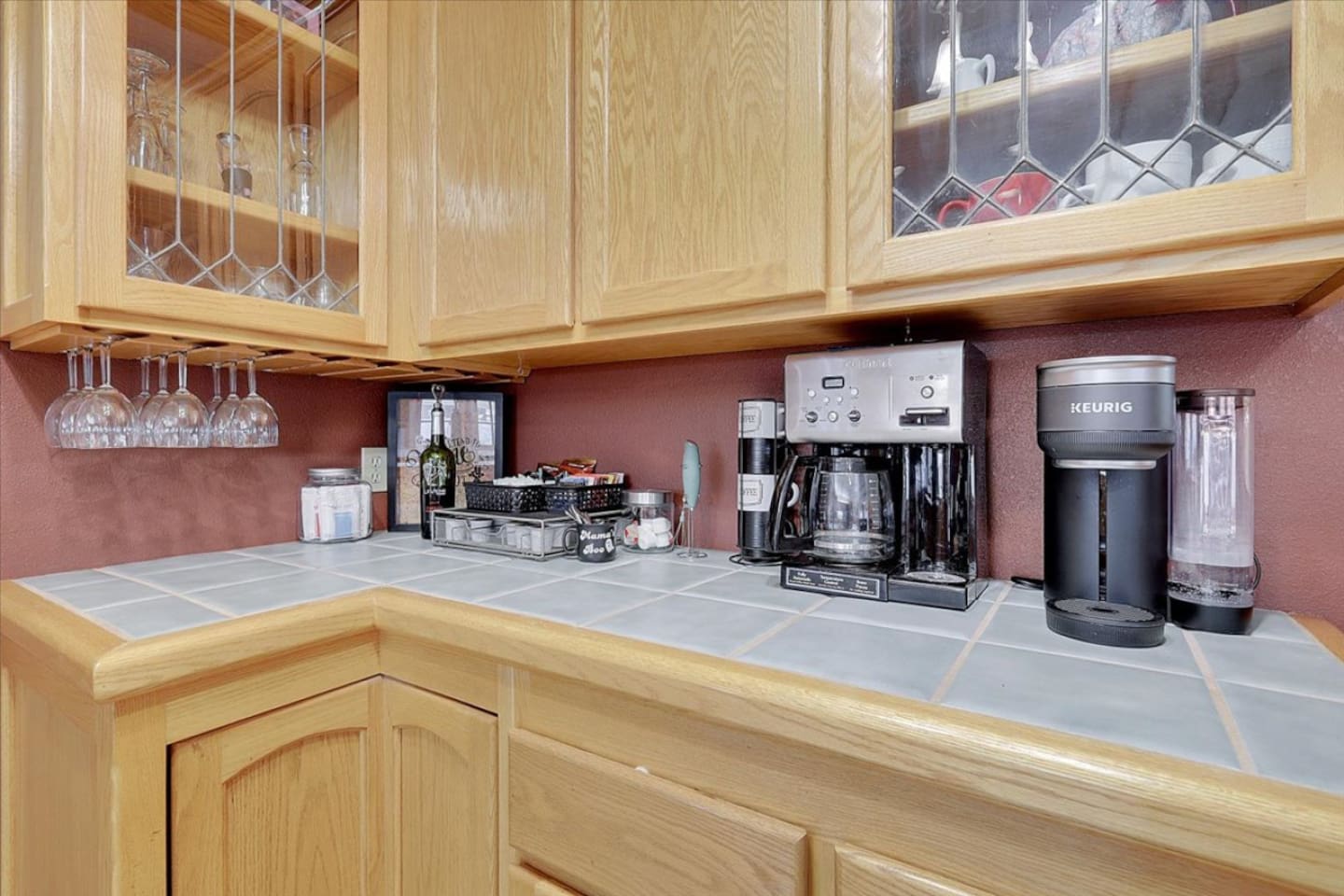 Coffee, tea, and wine station with extra cabinet storage beside the dining area.
