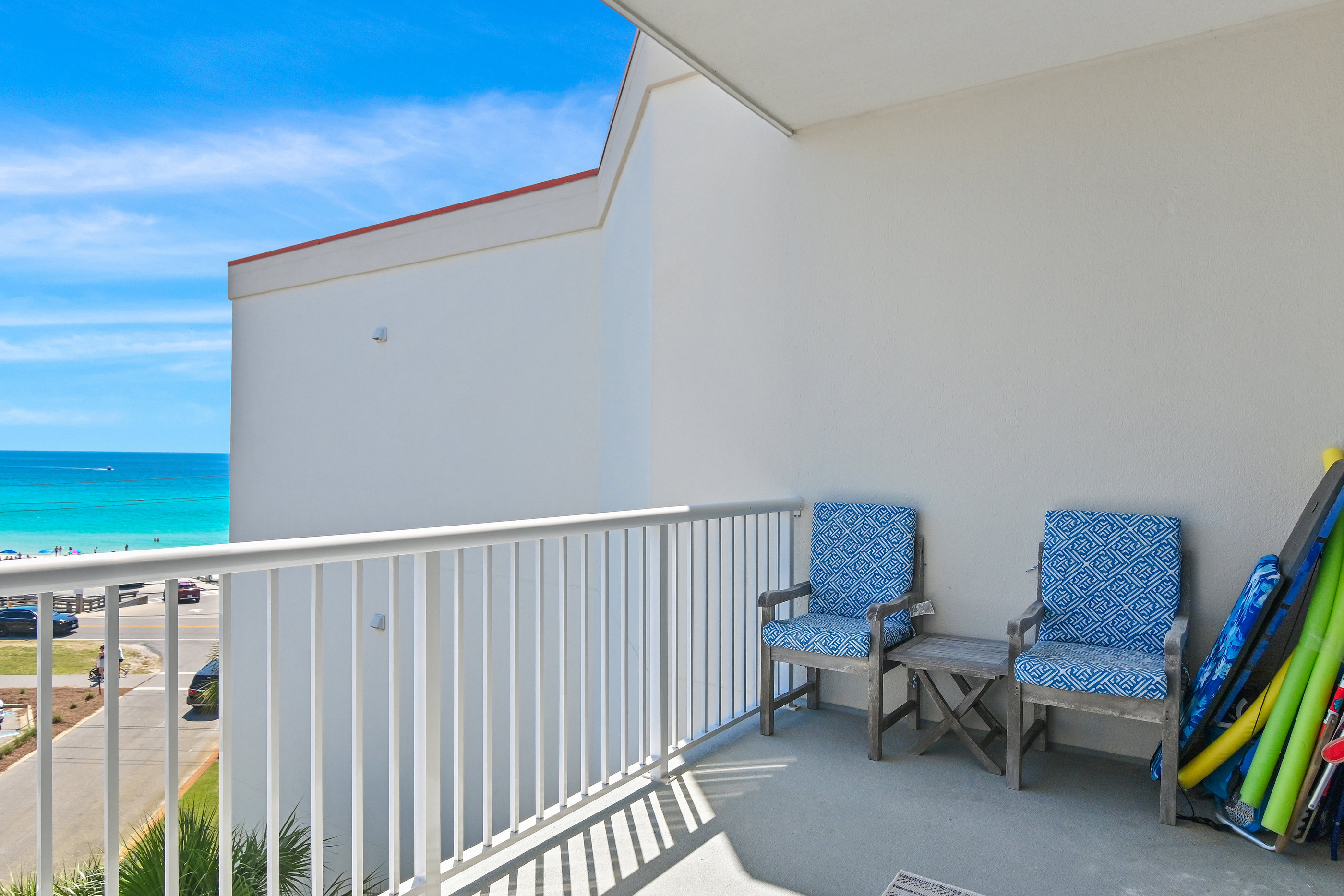 Balcony seating overlooking the sugar‑white sand