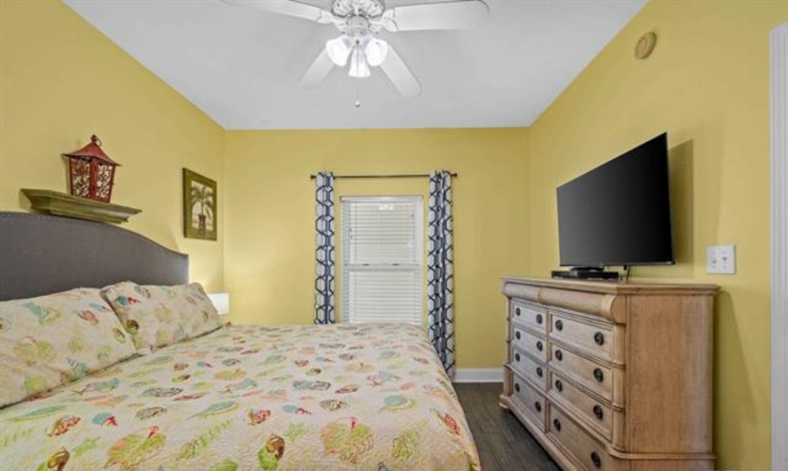 2nd bedroom with king bed, 50" Smart TV, double closet, ceiling fan, 2 bedside tables, 2 lamps & wn-suite bathroom
