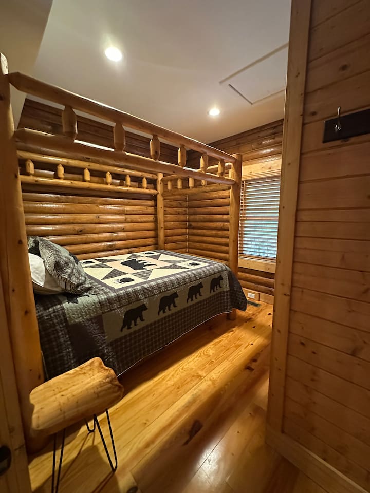 Bedroom #3 on upper level of the cabin / queen sized bed