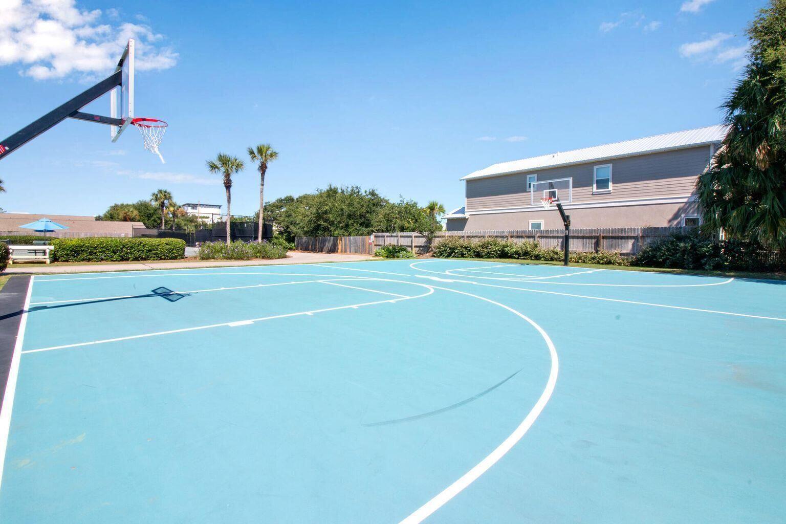 Outdoor basketball court on-site, perfect for a quick game or shooting hoops under the sun.