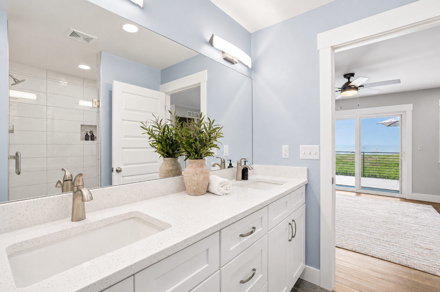Start your day with ample counter space, dual sinks, and bright, modern lighting designed to make mornings effortless.