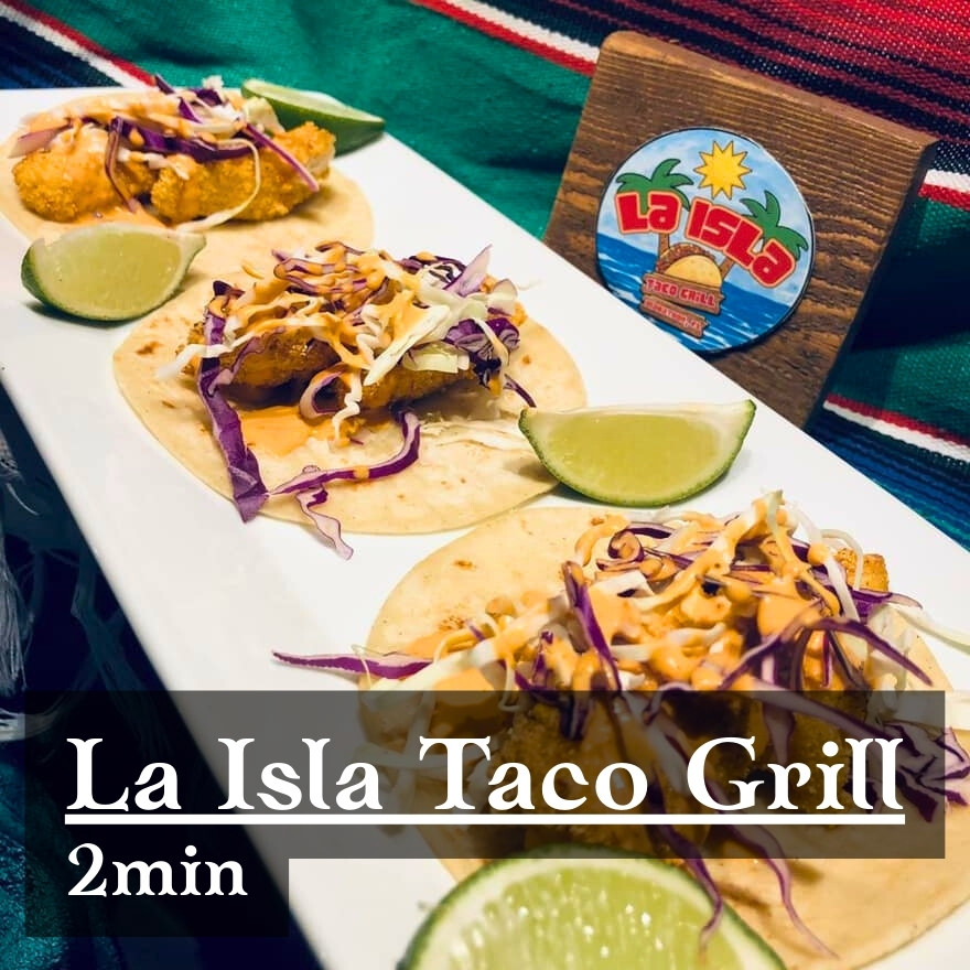 Grab delicious tacos from the La Isla Taco stand.