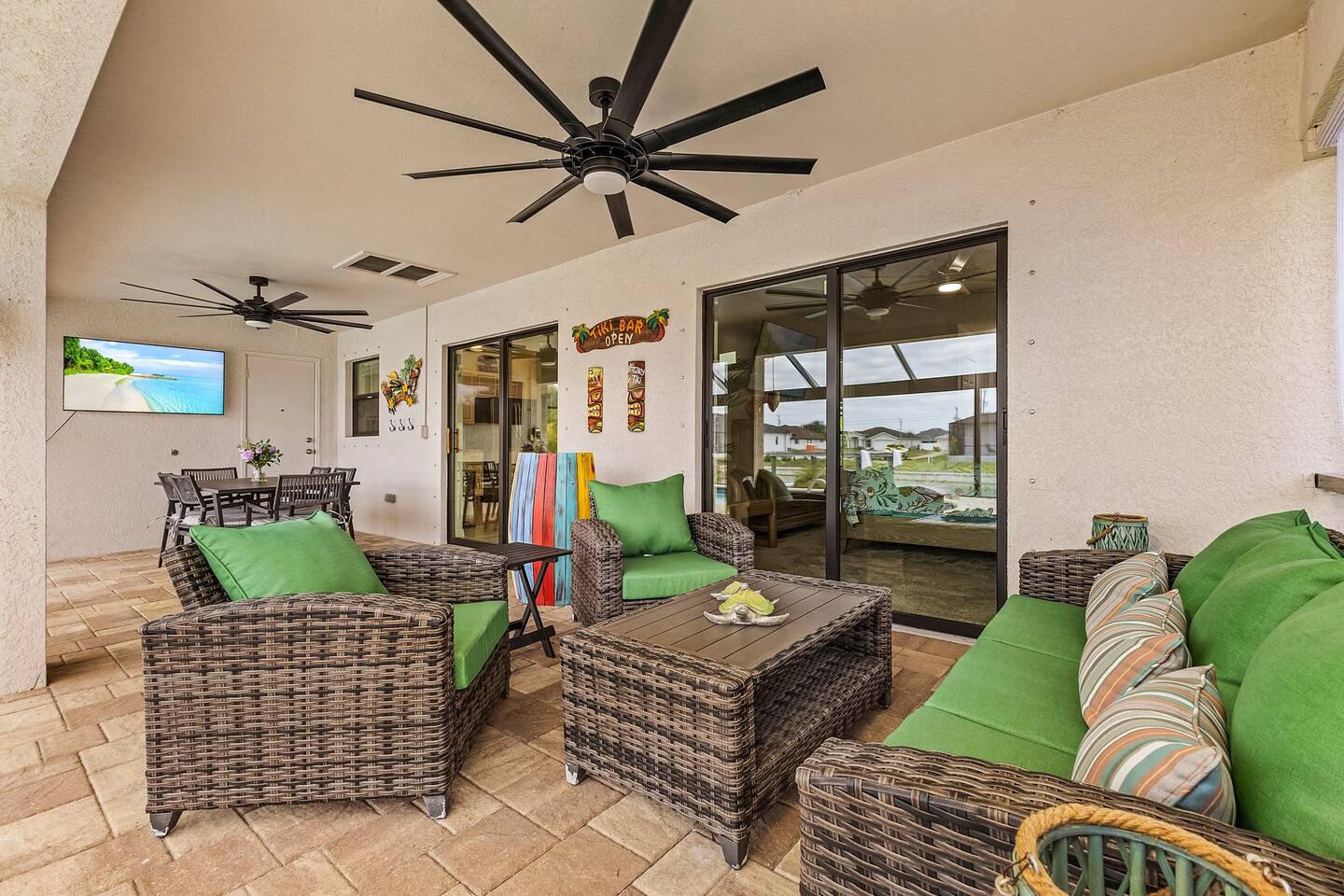 Enjoy Florida outdoor living with comfortable seating and an outdoor TV.
