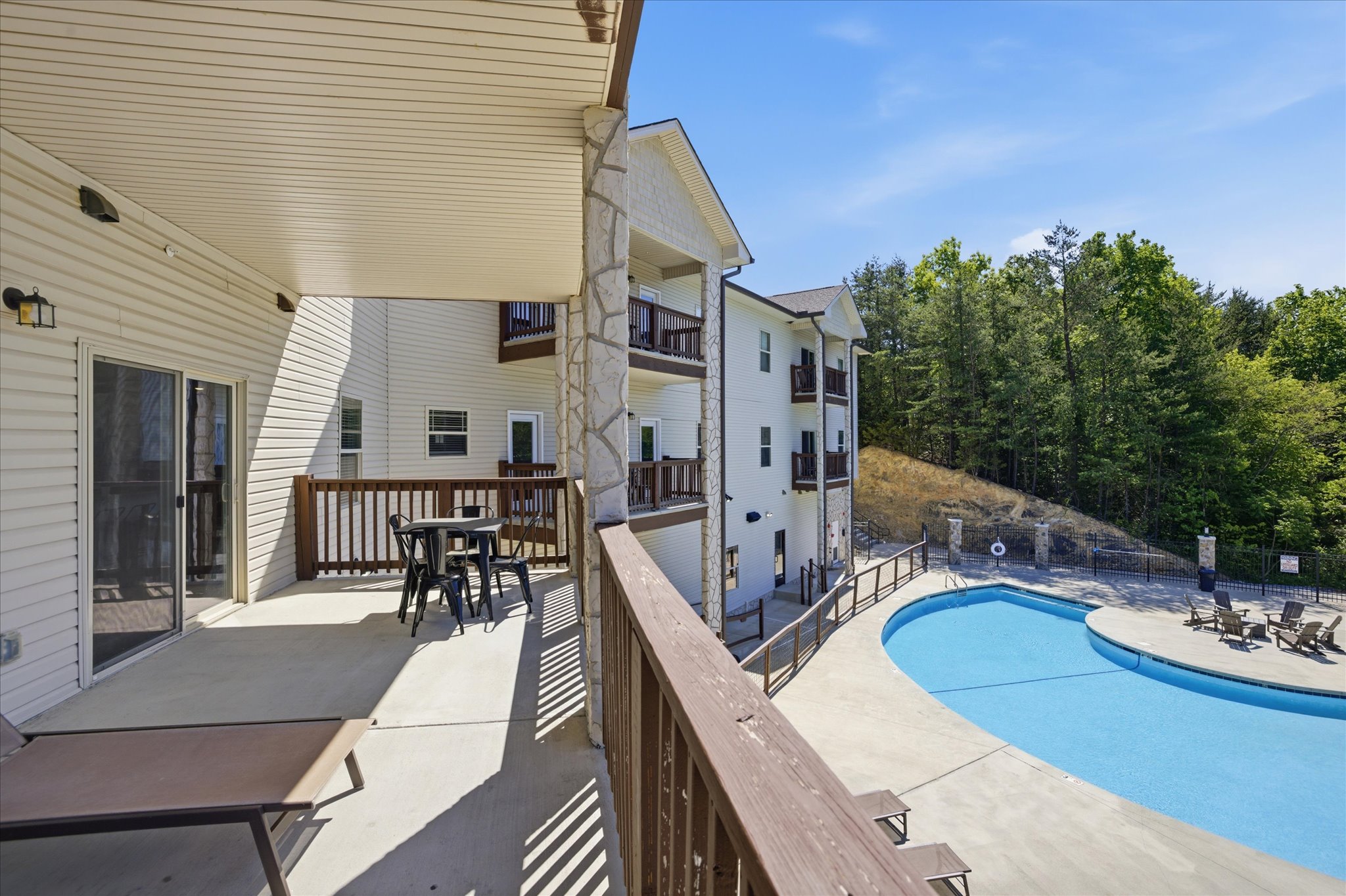 Set up for more than just a quick step outside, this porch in Unit 3 lets you linger—loungers, seating, and extra space to make it part of your day.