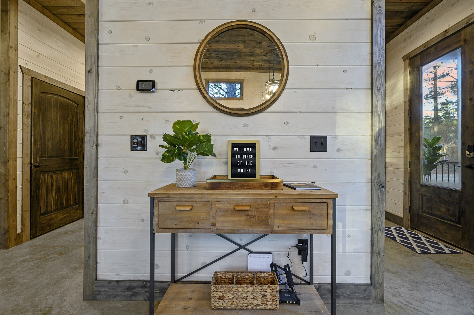 Natural textures and a simple console create a calming welcome. Drop your keys, breathe in the pine, and ease into vacation mode.