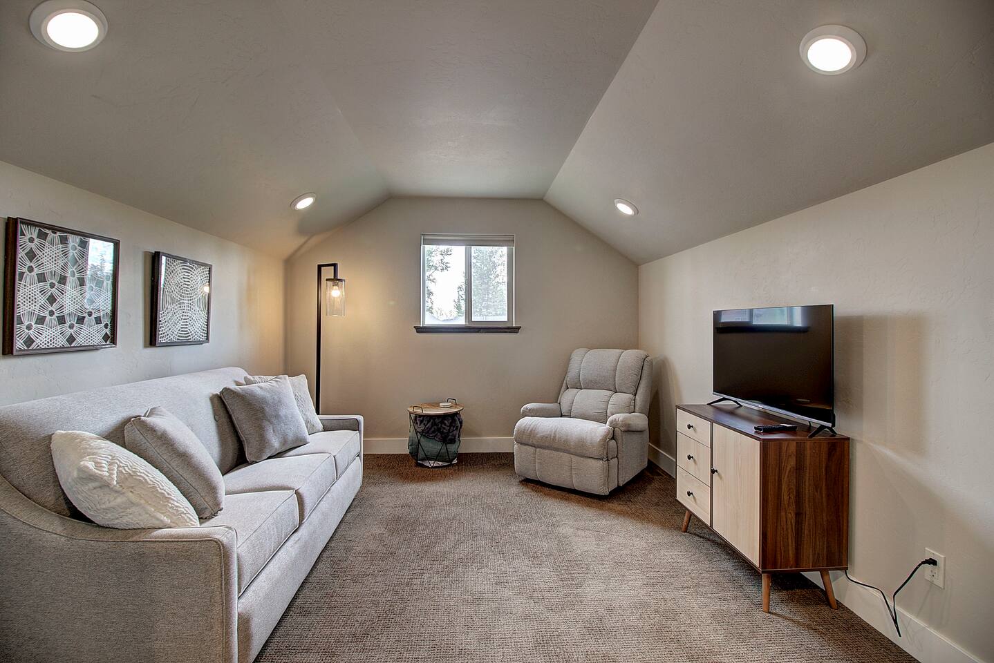 A comfy sofa and recliner, good view and a TV ready for movie night. This space is made for slowing down.