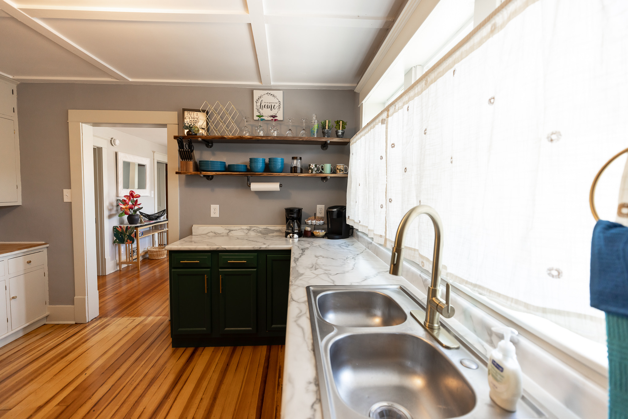 Your everyday dishes are easily accessible from the live edge open shelving.
