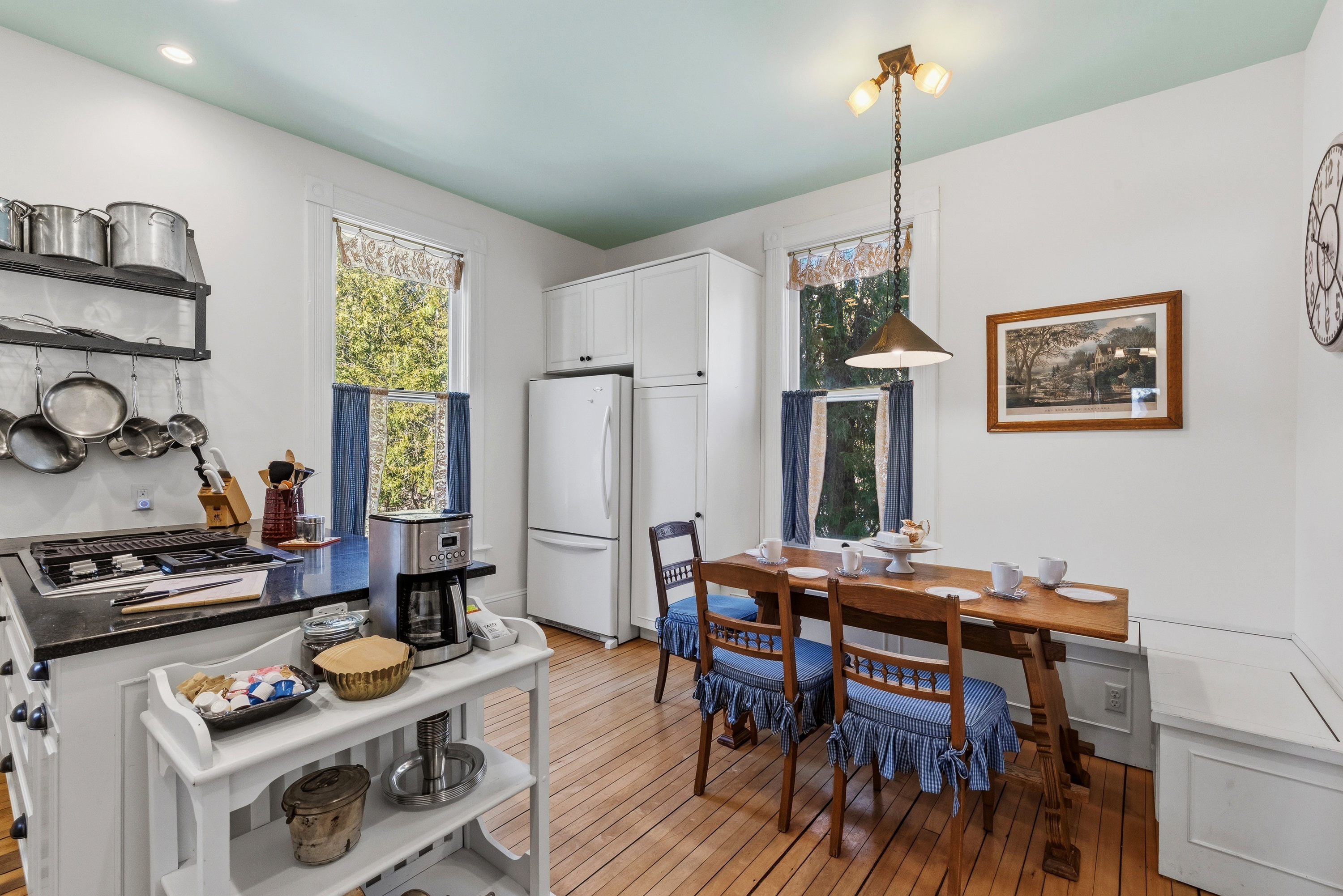 Bright kitchen w/ white cabinetry & clean, updated finishes