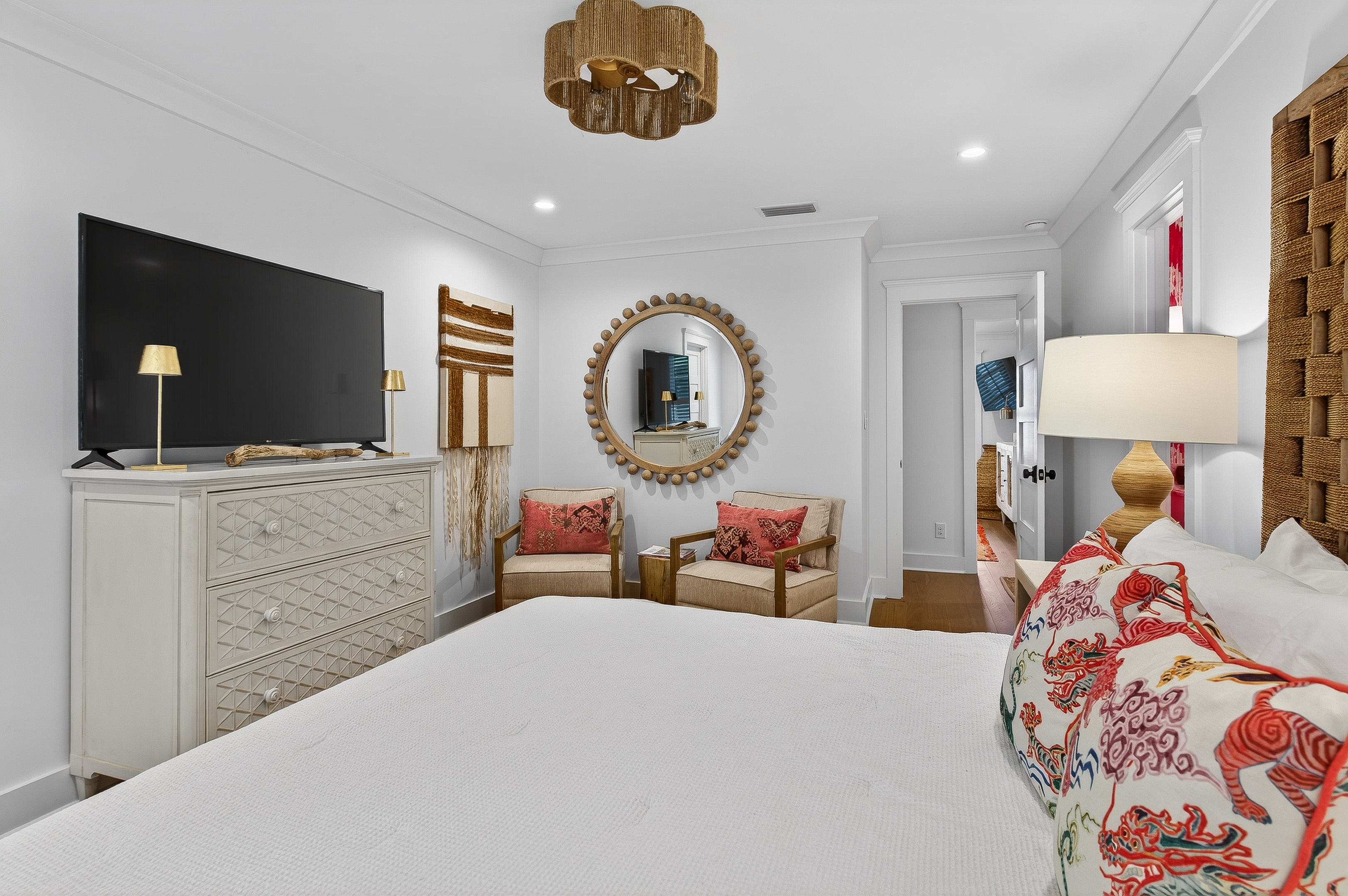 King suite with cozy seating nook, TV, and ensuite access