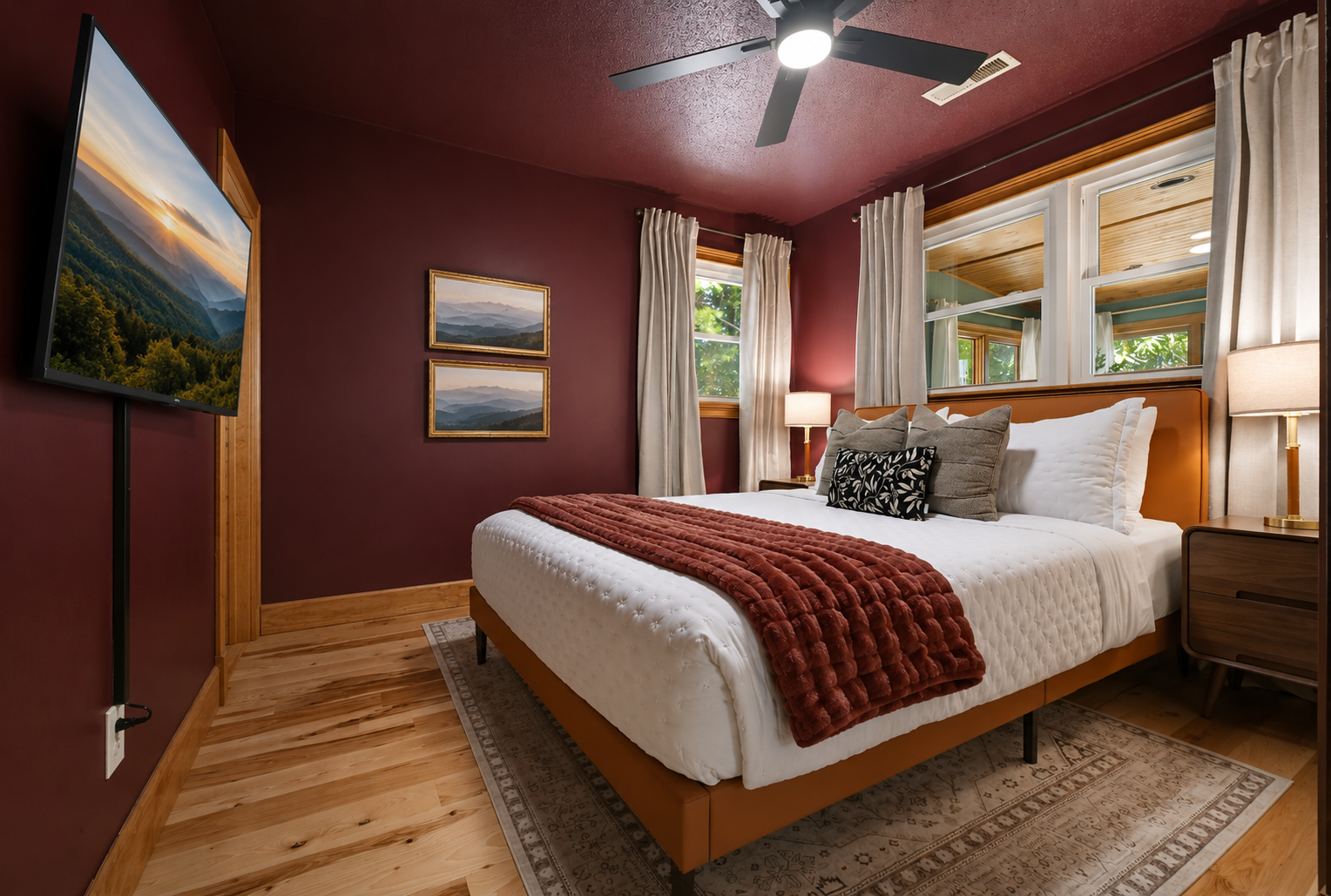 {Bedroom 2} Wrapped in warm tones with peaceful woodland views, this inviting Queen Ensuite offers a quiet place to relax and recharge between adventures.
